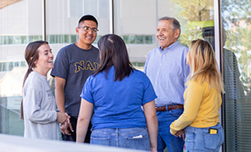 students talking outside